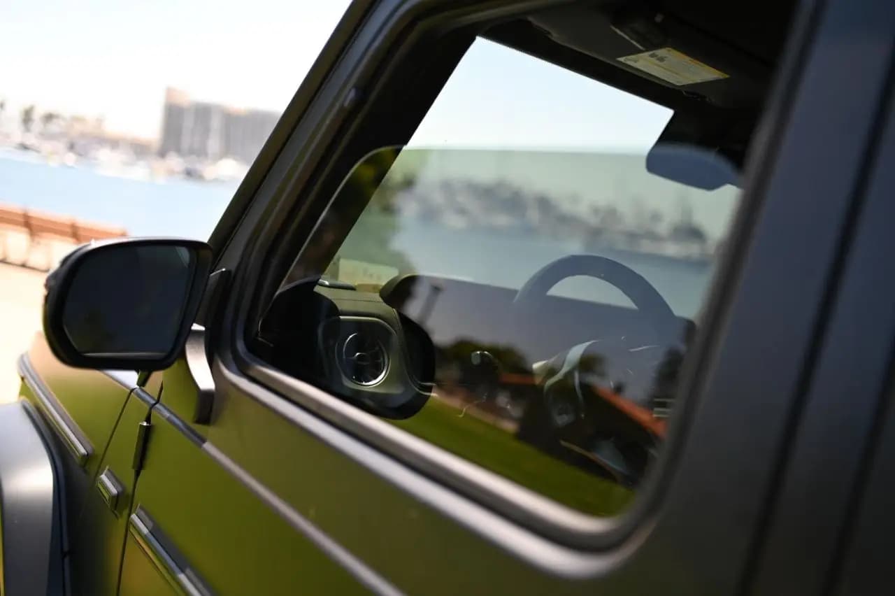 Daylight through a tinted door window of a parked vehicle